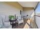 The screened balcony offers comfortable seating, with space for enjoying the serene outdoors at 31 Estuary Trl, Clearwater, FL 33759