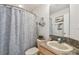 Well-lit bathroom featuring a shower-tub combination and vanity with ample counter space at 31 Estuary Trl, Clearwater, FL 33759