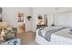 Inviting bedroom featuring comfortable seating and a view into an en-suite bathroom at 31 Estuary Trl, Clearwater, FL 33759