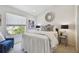Comfortable bedroom with a queen bed, offering a serene retreat for rest and relaxation at 31 Estuary Trl, Clearwater, FL 33759