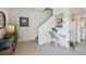 Inviting foyer with a charming console table, decor, and stylish stairway leading to the next level at 31 Estuary Trl, Clearwater, FL 33759