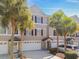Charming townhome featuring a garage, well-kept landscaping, and a neutral exterior at 31 Estuary Trl, Clearwater, FL 33759