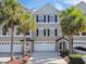 Townhome featuring a two-car garage and a neutral exterior with well-maintained landscaping at 31 Estuary Trl, Clearwater, FL 33759
