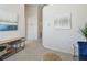 Inviting hallway with neutral tones and stylish decor, seamlessly connecting different areas of the home at 31 Estuary Trl, Clearwater, FL 33759