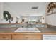 Kitchen sink area offering natural light from the adjacent living room at 31 Estuary Trl, Clearwater, FL 33759