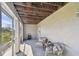 Cozy screened lanai with comfortable seating, providing a peaceful spot for relaxation and outdoor enjoyment at 31 Estuary Trl, Clearwater, FL 33759
