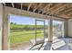 Screened lanai with lush green views, perfect for enjoying the outdoors in comfort and tranquility at 31 Estuary Trl, Clearwater, FL 33759