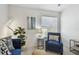 Cozy living room featuring a blue armchair and tasteful decor, creating a relaxing and inviting atmosphere at 31 Estuary Trl, Clearwater, FL 33759