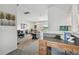 Bright living area with a view of the outdoors adjacent to a kitchen and dining area at 31 Estuary Trl, Clearwater, FL 33759