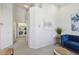 Bright living room with a view to the laundry room, seamlessly connecting different areas of the home at 31 Estuary Trl, Clearwater, FL 33759