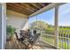 Relaxing screened patio with an outdoor dining table, offering a view of the green backyard at 31 Estuary Trl, Clearwater, FL 33759