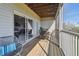 Comfortable screened patio with modern furniture, offering views through the open patio sliding door to the interior at 31 Estuary Trl, Clearwater, FL 33759
