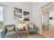 Cozy sitting area off the main bedroom with comfortable chairs and access to the balcony at 31 Estuary Trl, Clearwater, FL 33759