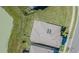 Birds eye view of a home, featuring a geometrically patterned roof and green grass at 32684 Tamarind Grove Ln, Wesley Chapel, FL 33543