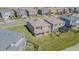 A high angle view of the back of the house showing the roof and the surrounding neighborhood at 32684 Tamarind Grove Ln, Wesley Chapel, FL 33543