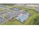Aerial view of the community pool, featuring plenty of space for residents and guests to enjoy at 32684 Tamarind Grove Ln, Wesley Chapel, FL 33543