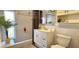 Bathroom with white vanity cabinet and a shower-tub combo at 3506 Moog Rd, Holiday, FL 34691