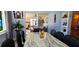 The Dining Room opens into the Living Room with comfortable seating and tranquil outdoor views at 3506 Moog Rd, Holiday, FL 34691