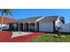 Charming one-story brick home featuring a driveway with a one car garage and mature landscaping at 3506 Moog Rd, Holiday, FL 34691
