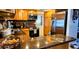 Kitchen with stainless steel appliances, wood cabinets and granite countertops at 3506 Moog Rd, Holiday, FL 34691