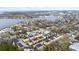 Aerial view of a residential neighborhood near a bay, highlighting the community's waterfront location at 423 Shaddock St, Tarpon Springs, FL 34689