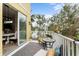 Balcony with seating, an outdoor table, and views of the neighborhood at 423 Shaddock St, Tarpon Springs, FL 34689