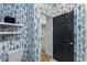 Bathroom featuring fish-themed wallpaper and white shelves at 423 Shaddock St, Tarpon Springs, FL 34689