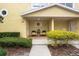 Charming front porch with seating area and decorative wreath, creating a welcoming entrance at 423 Shaddock St, Tarpon Springs, FL 34689