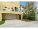 Spacious garage with an upstairs balcony area, offering ample parking and outdoor space at 423 Shaddock St, Tarpon Springs, FL 34689