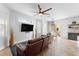 Bright living room with ceiling fan, TV, and luxury vinyl flooring at 423 Shaddock St, Tarpon Springs, FL 34689