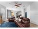 Bright living room with a ceiling fan, stylish furniture, and an open floor plan at 423 Shaddock St, Tarpon Springs, FL 34689