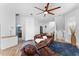 Cozy living room with a comfortable leather sofa, ceiling fan, and inviting decor at 423 Shaddock St, Tarpon Springs, FL 34689