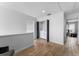 Bright loft space featuring light wood flooring, a closet with laundry equipment, and a view to the bedroom at 423 Shaddock St, Tarpon Springs, FL 34689