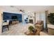 Living room showcasing a white fireplace, tiled floors, and a ceiling fan at 4238 Brentwood Park Cir, Tampa, FL 33624