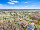 Expansive aerial view of home and community featuring landscaped grounds, lakes, and neighborhood amenities at 4495 Casella Dr, Wesley Chapel, FL 33543