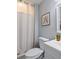 Cozy bathroom featuring shower with curtain, framed art and vanity with sink at 4588 Baycedar Ln, Sarasota, FL 34241
