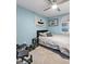 This bedroom offers ample natural light with a large window, complemented by a stylish decor and comfortable furniture at 4588 Baycedar Ln, Sarasota, FL 34241