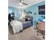 Bright bedroom with a sleek, modern bed frame, light walls, and a ceiling fan for added comfort at 4588 Baycedar Ln, Sarasota, FL 34241