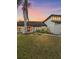 Charming two-story home with manicured lawn, black trim windows, and lush landscaping at 4588 Baycedar Ln, Sarasota, FL 34241