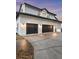 Spacious two-car garage with dark doors and modern exterior lighting at 4588 Baycedar Ln, Sarasota, FL 34241
