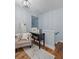 Cozy hallway nook featuring a stylish chair, a small accent table, and warm lighting creating an inviting space at 4588 Baycedar Ln, Sarasota, FL 34241