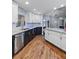 A spacious kitchen boasts modern appliances, including stainless steel, with sleek countertops and contrasting cabinetry at 4588 Baycedar Ln, Sarasota, FL 34241