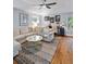 Inviting living room with vaulted ceilings, hardwood floors, and lots of natural light at 4588 Baycedar Ln, Sarasota, FL 34241