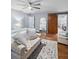 Light-filled main bedroom boasts wood floors and stylish sliding barn door at 4588 Baycedar Ln, Sarasota, FL 34241