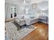 Comfortable main bedroom with ceiling fan, hardwood floors, and direct access to outdoor area at 4588 Baycedar Ln, Sarasota, FL 34241