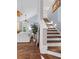Bright stairway featuring wood steps, seamlessly connecting the home's levels with open living area views at 4588 Baycedar Ln, Sarasota, FL 34241