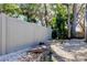 Backyard featuring privacy fence, decorative rock, bridge and plenty of greenery at 4967 162Nd N Ave, Clearwater, FL 33760