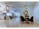 Open-concept living area featuring dining table with chairs, kitchen and living room in background at 4967 162Nd N Ave, Clearwater, FL 33760