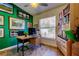 Bright home office with a view from a large window, a ceiling fan and a bookcase at 4967 162Nd N Ave, Clearwater, FL 33760