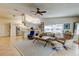 Open concept living room flows into bright kitchen with stainless appliances and breakfast bar at 4967 162Nd N Ave, Clearwater, FL 33760